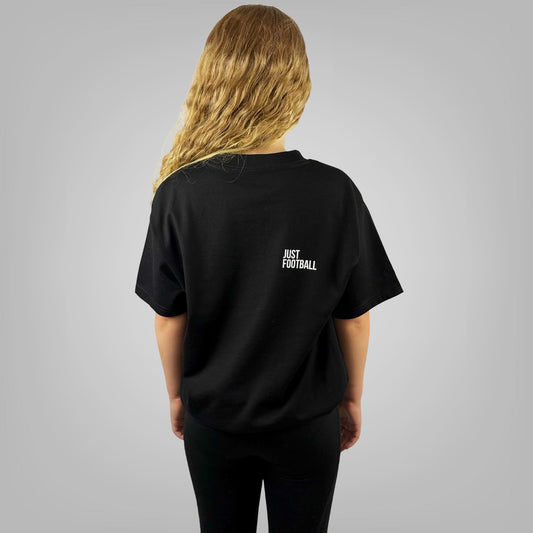JUST FOOTBALL girls black t-shirt with large back print, rear view on light grey background