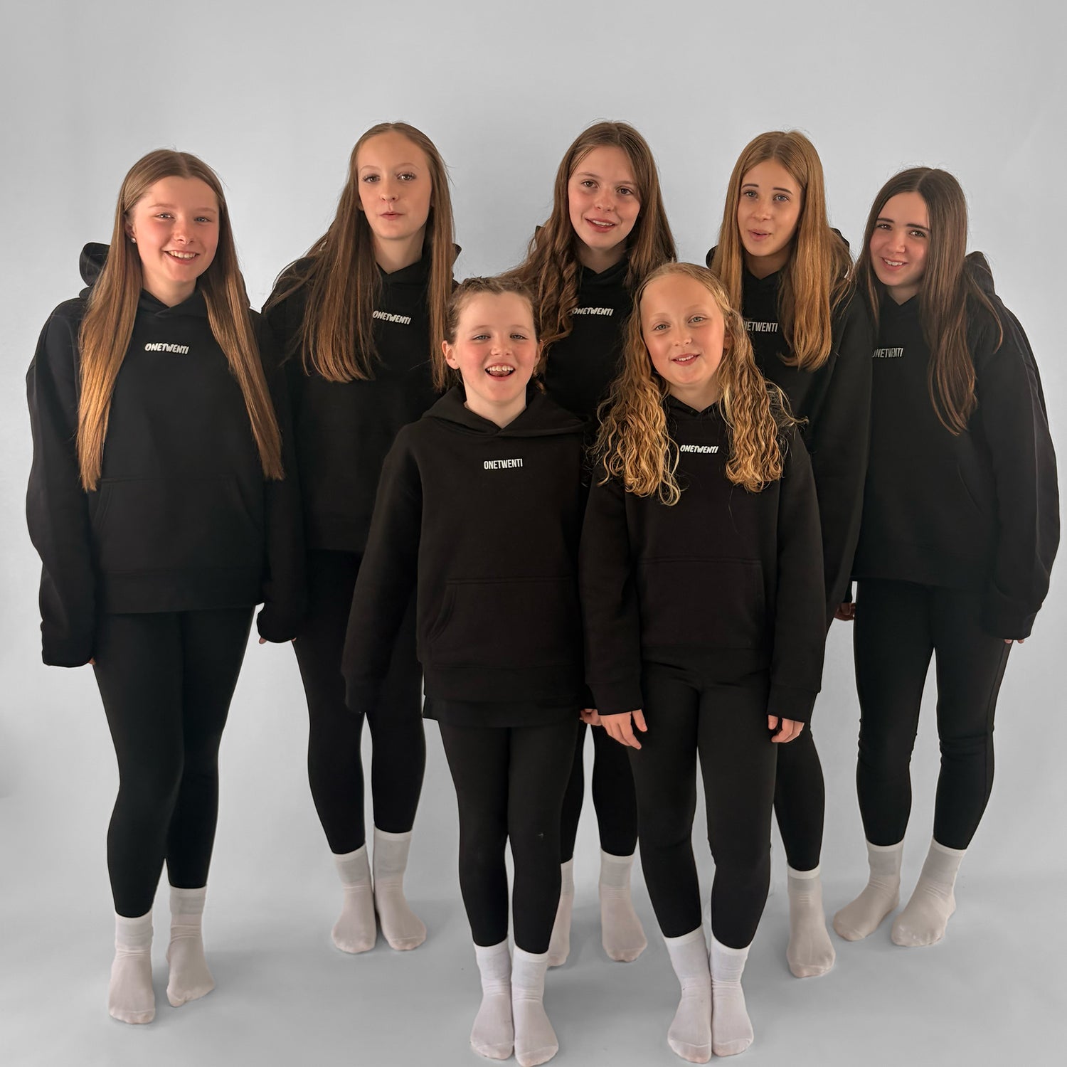 Group of girls wearing ONETWENTI hoodies, representing the 120 Members community in women’s football