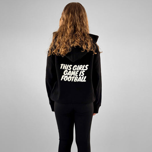 Back of black ONETWENTI This Girl’s Game Is Football hoodie worn by younger model